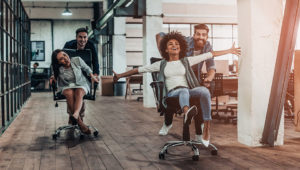 Co-workers having fun on stylish office chairs in Cape Town